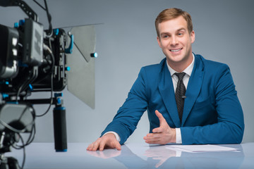 Newsman during shooting process.