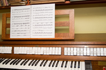 organ keyboard and sheet music