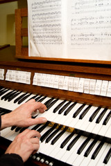 organ keyboard and sheet music