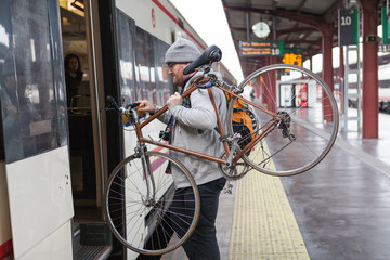Image result for man with bike getting off train