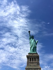 Fototapeta na wymiar Statue of Liberty with cloudy sky