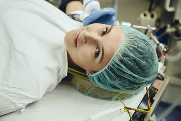 Smiling patient on operating room table