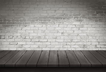Wood table with White brick wall background