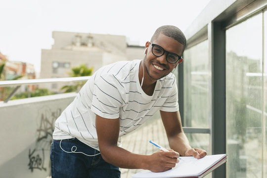 Young Afro-American man studying language