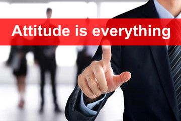 Businessman hand touching ATTITUDE IS EVERYTHING message on virtual screen