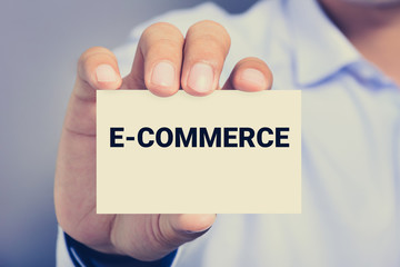 E-COMMERCE, text on the card shown by a man