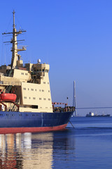 Fototapeta premium icebreaker parked in front of the bridge on island Russian in Vladivostok, Russia