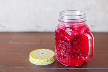 red soda water on the wood floor 