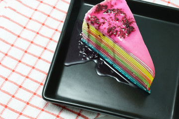 colorful cake on black dish