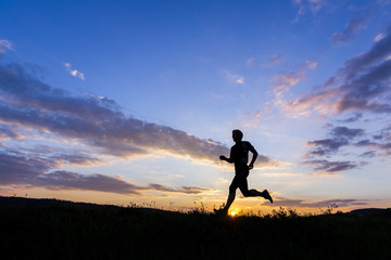 Man jogging at sunset