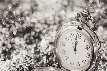 Fototapeta na wymiar Old watch pointing midnight - New Year concept