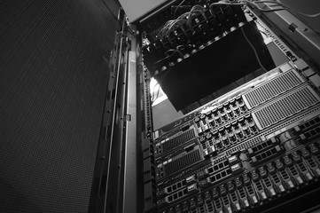 Bottom view of rack server against neon light in datacenter with