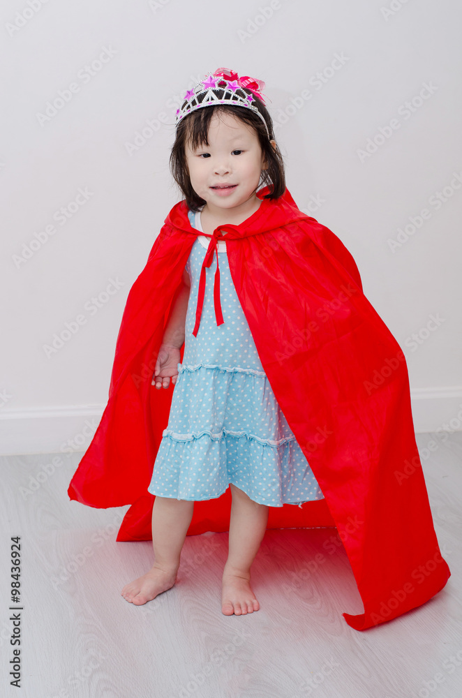 Wall mural Little Asian girl in princess costume