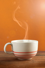 a cup of coffee or tea on colorful background