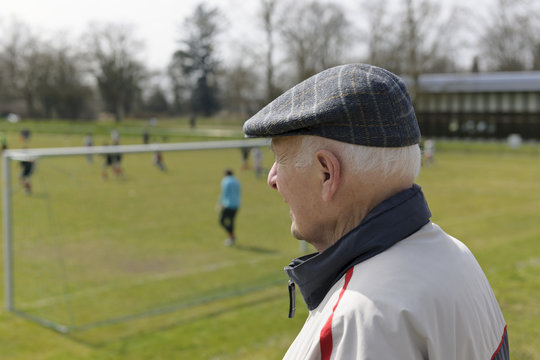 Old Man Watching Football Match