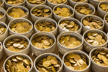 Buddha coin in bolw prepare for donate in public temple in Thail