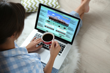 Woman using laptop to book hotel online