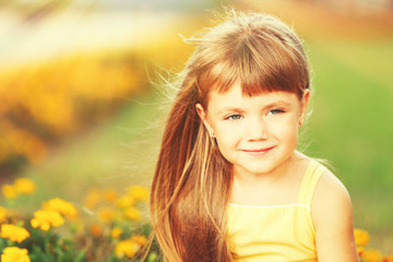 Little girl with flowers outside