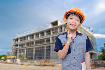 Young Asian boy at construction site