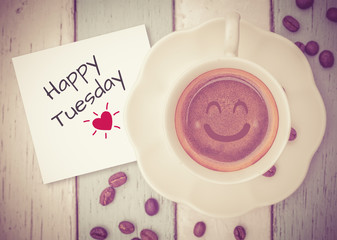 Happy Tuesday with coffee cup on table