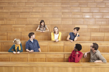 Germany, Leipzig, Group of university students sitting together in classroom