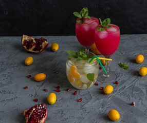 cocktails with mint garnish and the kumquats and pomegranate
