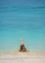 Woman relaxing on the idylic beach