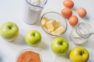 Apple pie ingredients on white