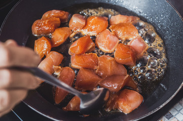 Chicken on a pan cooking