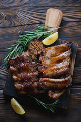 Baked pork ribs with lemon, garlic and rosemary, high angle view