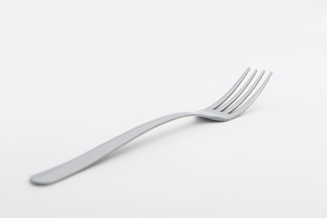 Silver fork on white background