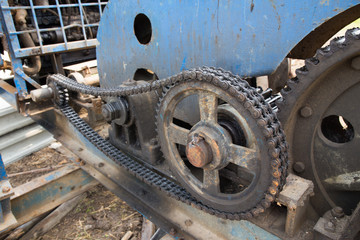 Fototapeta na wymiar durty chain and cogwheel in transmission system of pile driver