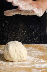 Kneading dough on wooden plate,bread cooking process