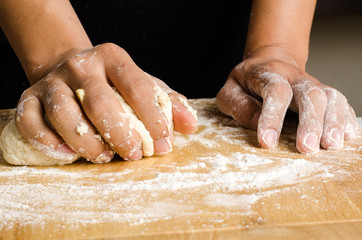 Kneading dough on wooden plate,bread cooking process