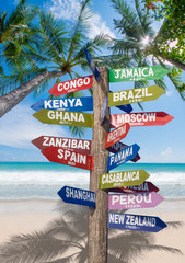Signs  showing distances to major countries on the tropical beac