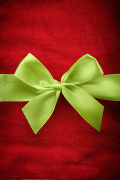 Green ribbon on red background