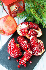 Ripe pomegranate on stone plate