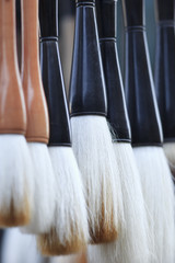 Row of paintbrushes for Chinese calligraphy, Panjiayuan Market, Beijing.