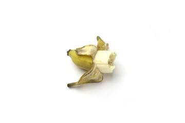 Bitten banana is isolated on the white background.