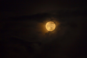 Full moon behind the clouds - 98457998