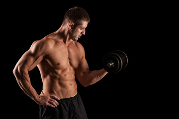 Fototapeta na wymiar muscular young man lifting weights