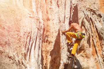 Mature male rock climber on the wall