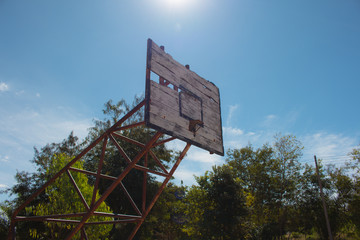 Basketball hoop is broken and wood board damaged ,Shiny wooden basketball