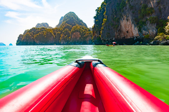 Canoeing in Phang nga bay along the large limestone rocks, Thail