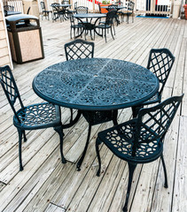 Wrought iron furniture on the outdoor cafe patio for Pleasant dining area experience