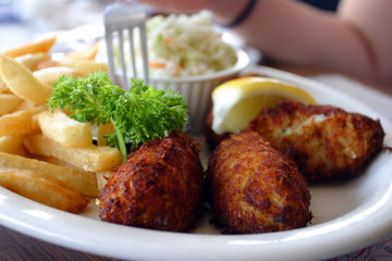 Breaded scampi tails with salad leaves ..