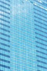 blue glass wall of skyscraper, abstract background.