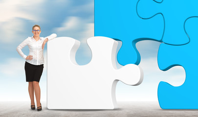 business woman building a puzzle on a sky background. business concept
