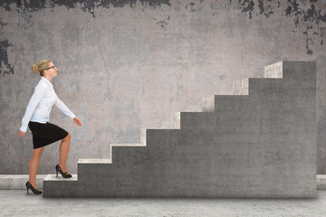 Business woman walking up a staircase. business concept
