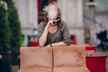 Fototapeta premium girl with E-cigarette